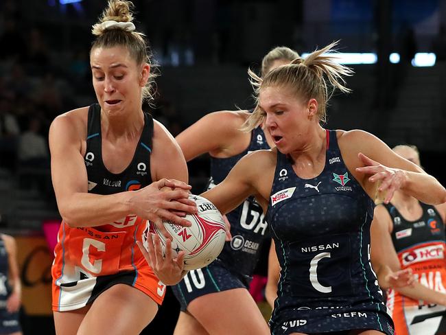 MELBOURNE, AUSTRALIA - MAY 23: Jamie-Lee Price of the Giants (L) and Kate Moloney of the Vixens compete for the ball during the round four Super Netball match between Melbourne Vixens and GWS Giants at John Cain Arena, on May 23, 2021, in Melbourne, Australia. (Photo by Graham Denholm/Getty Images)