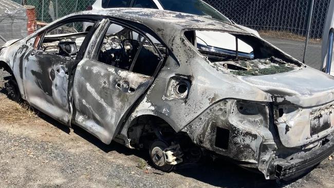 A burnt out stolen Toyota Corolla set alight in the Smithfield area. Picture: Supplied