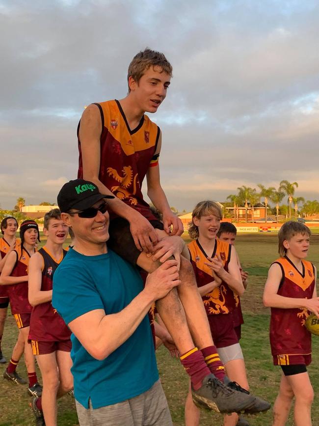 Albert Ebert is chaired off after his incredible game. Picture: SMOSH West Lakes Football Club