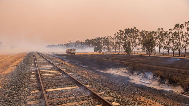 The local railway line was affected by the blaze. Picture: Jason Edwards