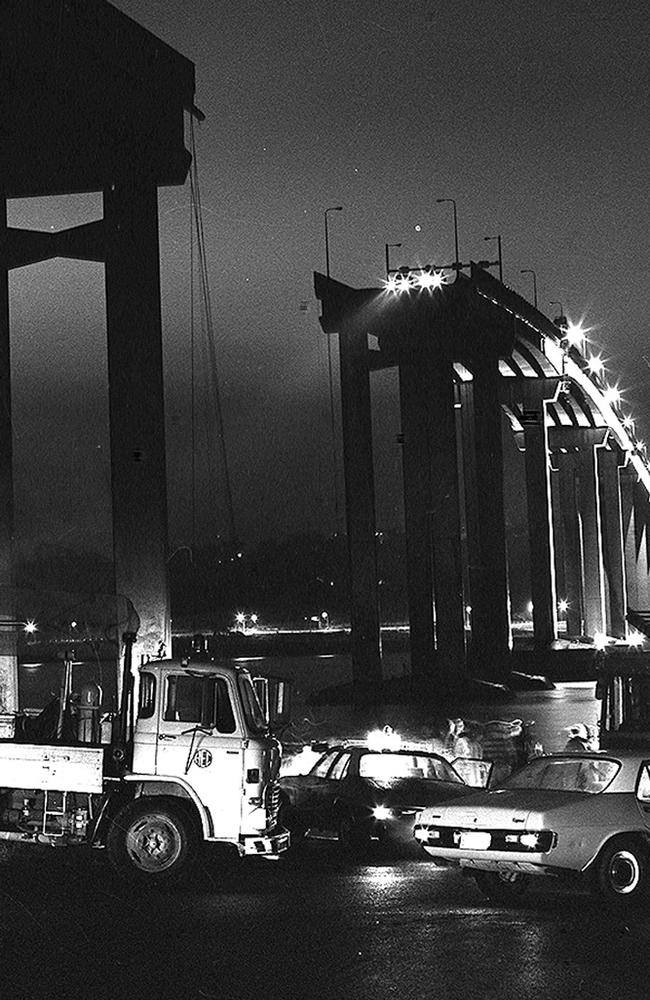 Cars teeter on the edge of the Tasman Bridge after it collapsed on January 5, 1975. Picture: Don Stephens