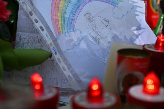 A drawing outside the Gemelli hospital depicts Pope Francis under a rainbow