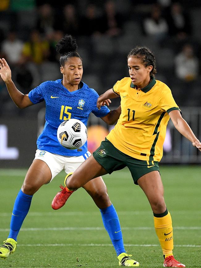 Brazil's Tainara De Souza Da Silva (L) vies for the ball with Australia's Mary Fowler.