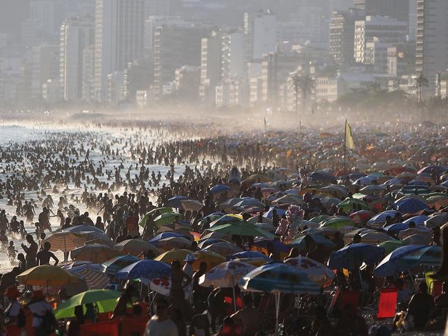 People line Ipanema beach on January 11, 2015 in Rio de Janeiro, Brazil. Rio residents flocked to the beach on the weekend as summer temperatures soared.