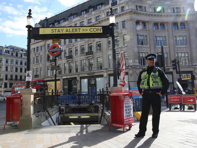 A police officer stands near the stairs to the tube station at Oxford Circus, central London. Picture: AFP