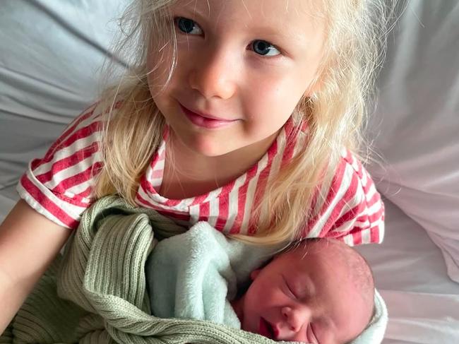 Lachie and Jules Neale’s daughter, Piper, with new sibling, Freddie.