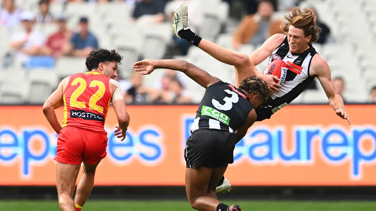 Magpie Nathan Murphy comes crashing back to earth after a gutsy mark.