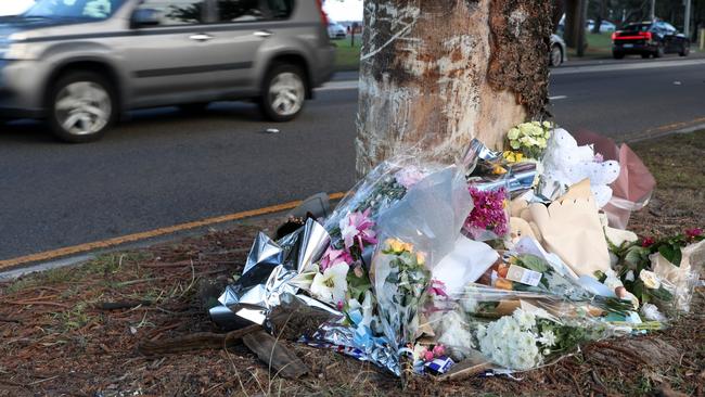 Flower and soft toy tributes at the scene of the crash. Picture: Damian Shaw