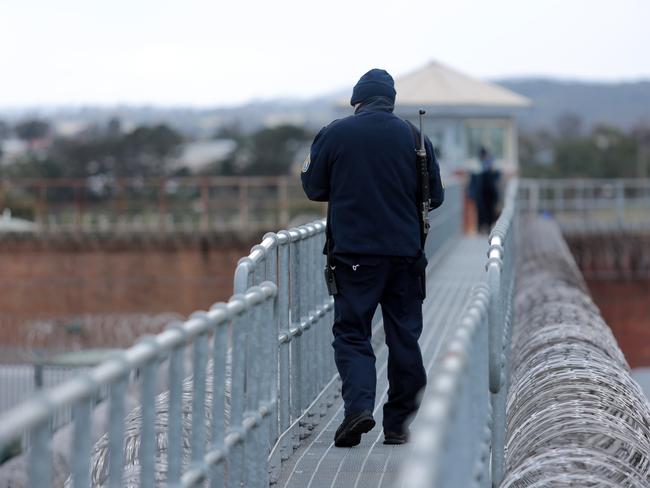 A prison officer watching over the separated yards. Picture: Tim Hunter