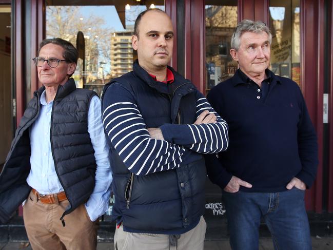 Porters Liquor manager Phil Pembroke (centre) pictured at his store in Darling Harbour with co owners Mick Hewett and Jim Schwilk.