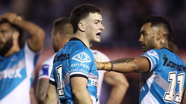 SYDNEY, AUSTRALIA - AUGUST 06: Kade Dykes of the Sharks celebrates victory with teammates after the round 21 NRL match between the Cronulla Sharks and the St George Illawarra Dragons at PointsBet Stadium, on August 06, 2022, in Sydney, Australia. (Photo by Matt King/Getty Images)