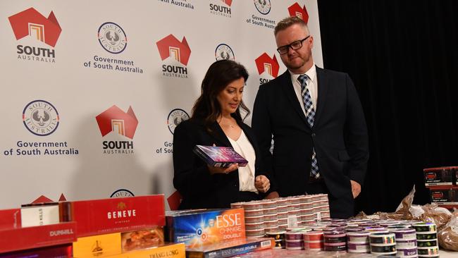 Consumer and Business Affairs Minister Andrea Michaels and Commissioner for Consumer Affairs Brett Humphrey boast biggest illicit tobacco bust with $1 million worth of product seized at a single store. Picture: Keryn Stevens.