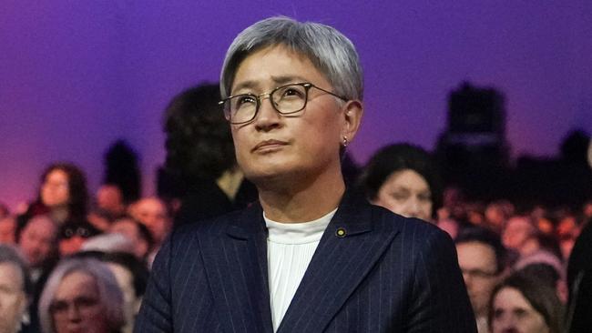 Australian Foreign Minister Penny Wong places lit candle candle at the Auschwitz-Birkenau former Nazi German concentration and extermination camp, during a ceremony marking the 80th anniversary of its liberation, in Oswiecim, Poland, Monday, Jan. 27. 2025. (AP Photo/Czarek Sokolowski)