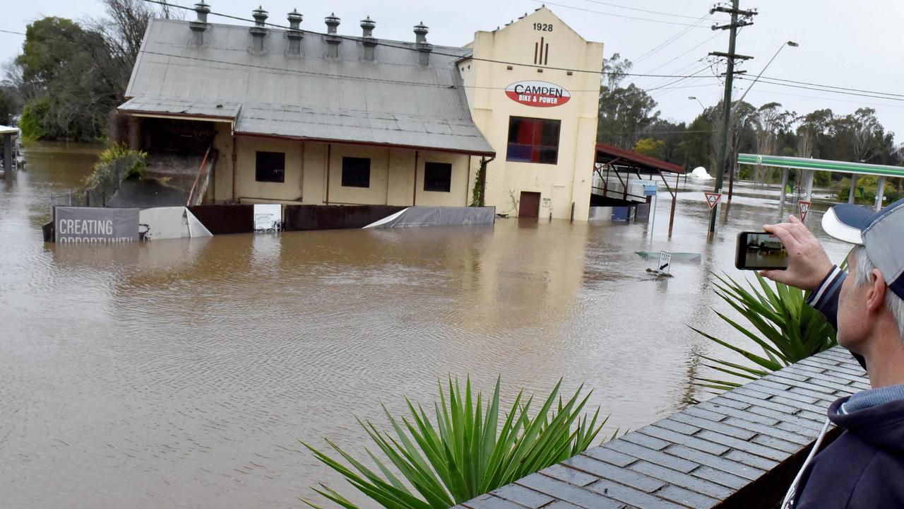 The flooded streets due to torrential rain in the Camden suburb of Sydney on July 3, 2022. – (Photo by Muhammad FAROOQ / AFP)
