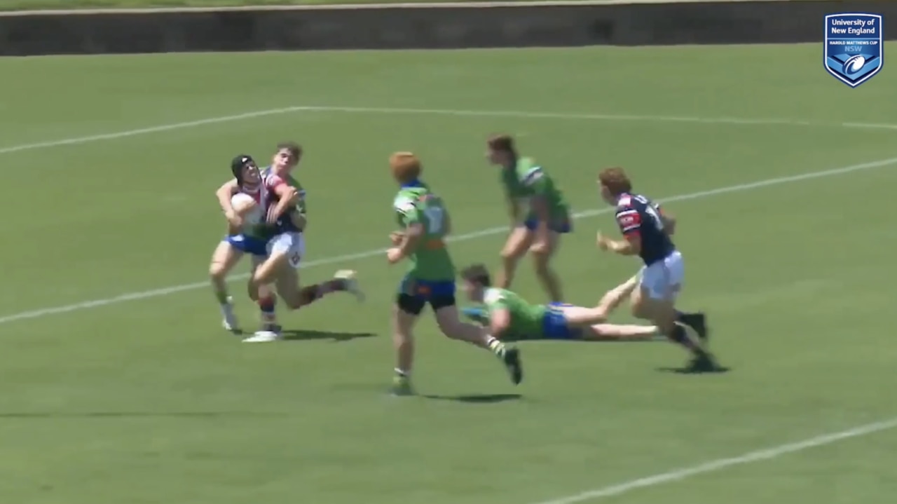 Tody Rodwell (head gear) leaves a trail of defenders in his wake.