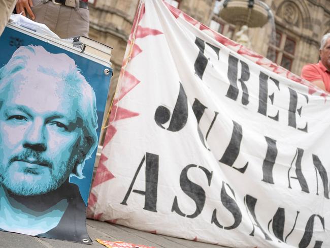 Supporters of WikiLeaks founder Julian Assange attend a small protest near the State opera in Vienna on June 8. Picture: AFP