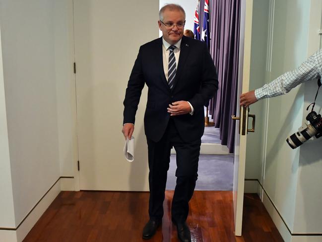 Prime Minister Scott Morrison leaves after a press conference revealing a state-based cyber attack targeting Australian government and business. Picture: AAP