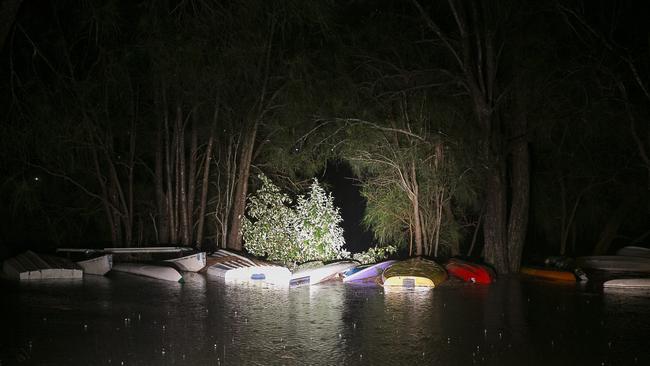 The hulls of upturned submerged boats sit in a flooded reserve in Narrabeen. Picture: Chris McKeen