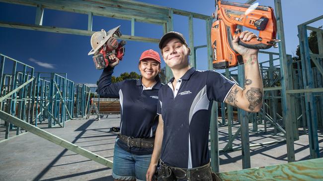 Apprentice carpenters Jasmine Brady 17, and Britney Fiorello 21, on the job at Brighton. Picture: Lachie Millard