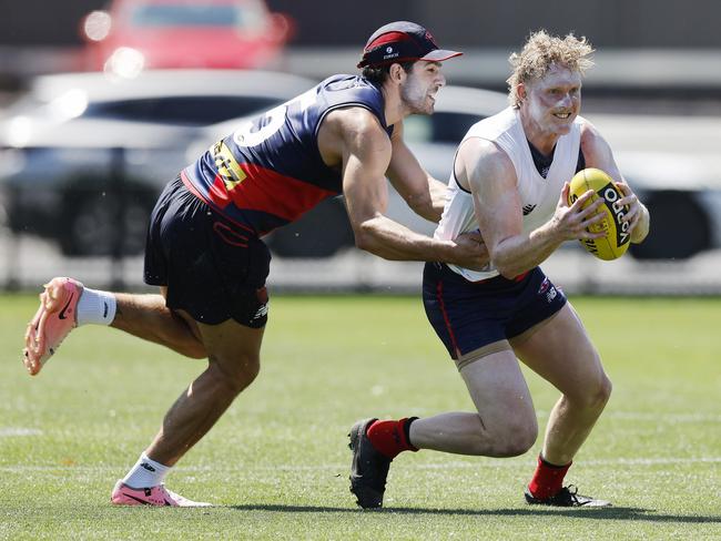 Petracca and Oliver tackled by Christian Petracca during todays training session. Picture: Michael Klein