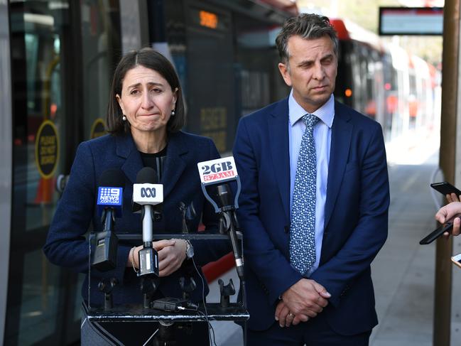 NSW Premier Gladys Berejiklian and NSW Minister for Transport Andrew Constance speak to the media after riding on the first light rail vehicle test from Town Hall to Circular Quay in Sydney, Wednesday, August 28, 2019. (AAP Image/Joel Carrett) NO ARCHIVING