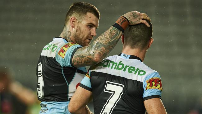 Chad Townsend (No. 7) of the Sharks embraced by Josh Dugan (Photo by Brett Hemmings/Getty Images)