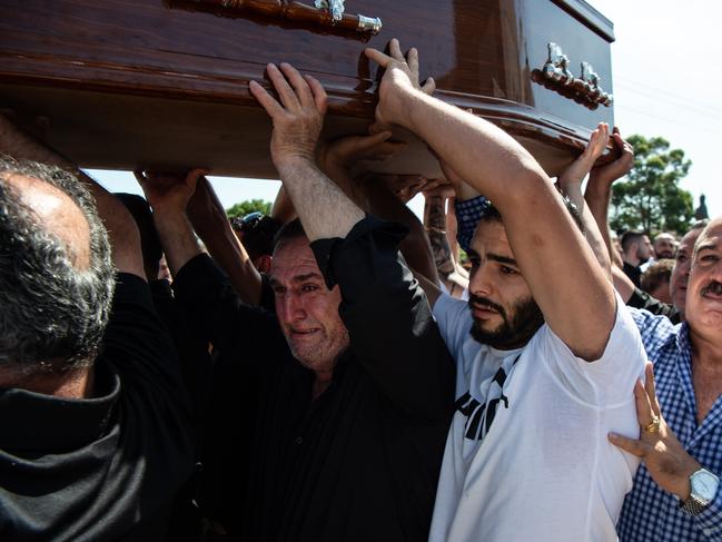 Mourners carried the coffin of Alfredo Isho. Picture: Monique Harmer.