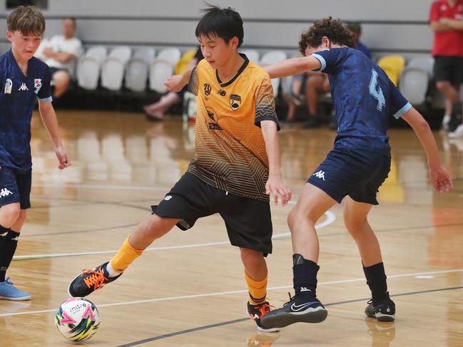 National Futsal Championships 2024 at Carrara. Western Australia (yellow) V NSW Metro U/13 boys. Picture Glenn Hampson