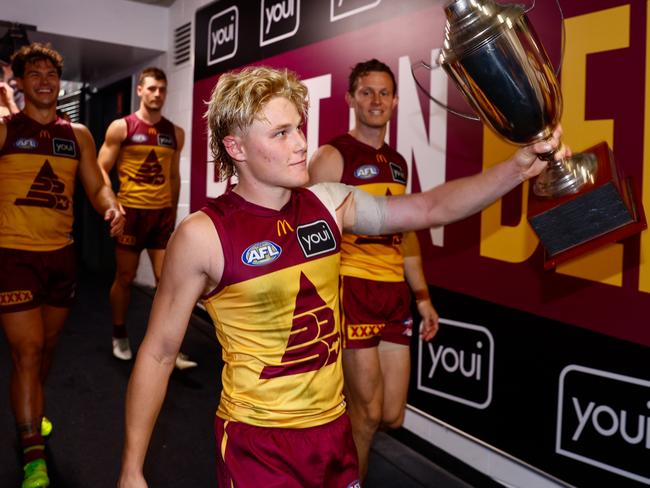 BRISBANE, AUSTRALIA - MAY 04: Levi Ashcroft of the Lions is seen carrying the QClash Trophy during the 2025 AFL Round 08 match between the Brisbane Lions and the Gold Coast Suns at The Gabba on May 4, 2025 in Brisbane, Australia. (Photo by Russell Freeman/AFL Photos via Getty Images)