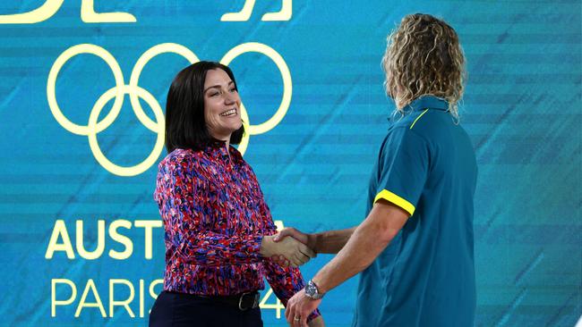 Chef de Mission Anna Meares and swimming coach Dean Boxall shake hands during the Australian 2024 Paris Olympic Games swimming squad announcement