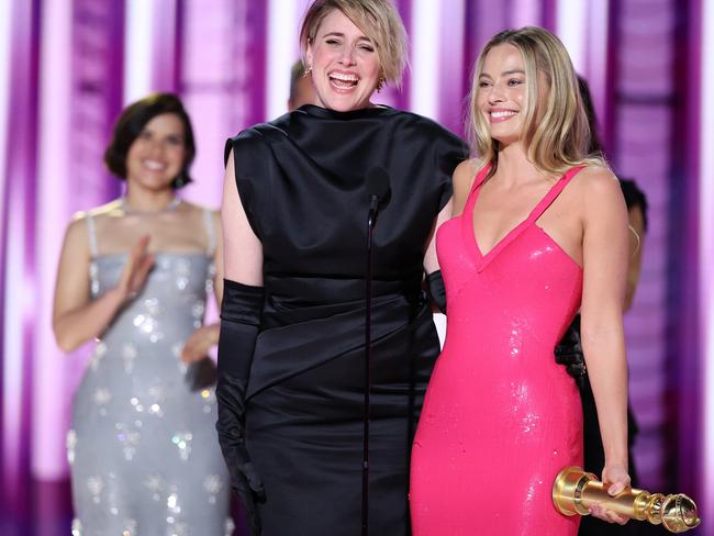 Greta Gerwig and Margot Robbie accept the award for Cinematic and Box Office Achievement for Barbie at the 81st Golden Globe Awards. Picture: via Getty Images