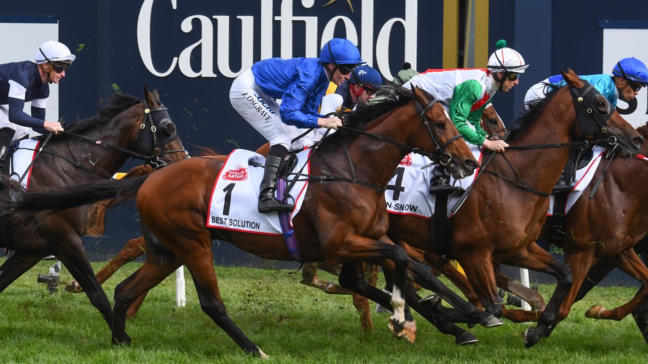 Pat Cosgrave and Best Solution approach the first turn before going on to win the Caulfield Cup. Picture: Getty Images