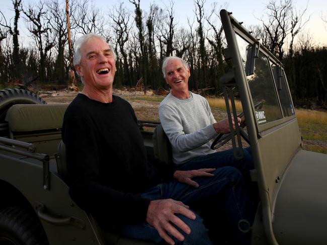 Twin brothers David and Peter Abel have been living in a caravan on their block outside of Mogo since their house was destroyed. Picture: Toby Zerna