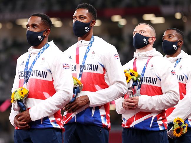 TOKYO, JAPAN - AUGUST 07:  Silver medal winners CJ Ujah, Zharnel Hughes, Richard Kilty and Nethaneel Mitchell-Blake of Team Great Britain stand on the podium during the medal ceremony for the Men's 4 x 100m Relay on day fifteen of the Tokyo 2020 Olympic Games at Olympic Stadium on August 07, 2021 in Tokyo, Japan. (Photo by Christian Petersen/Getty Images)