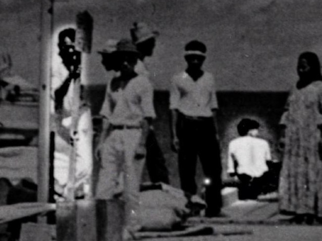 Last week amateur historian Les Kinney argued this US intelligence photo showed co-pilot Fred Noonan, left, with Amelia Earhart sitting on the edge of a pier in the Marshall Islands in 1937.