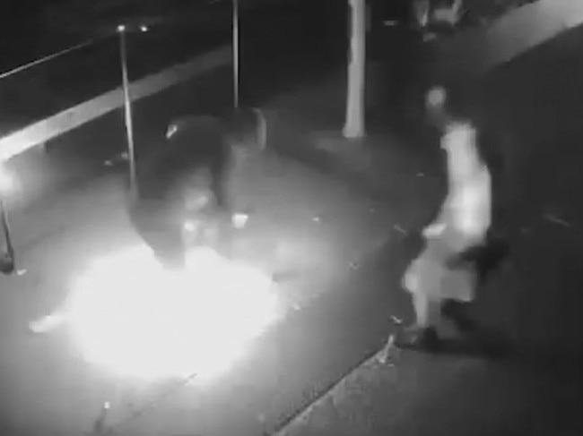 The mate of the would-be arsonist rushes to help his accomplice. Picture: VicPol