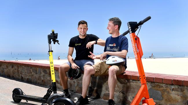 Toby Pym (Operations Manager RIDE) and Jayden Bryant (Neuron City Manager) at Glenelg Beach. Picture: Tricia Watkinson