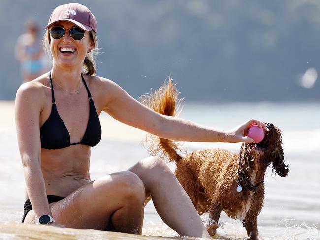 Sophie Wood took her dog Bagel to Ettalong Beach to beat the heat on Saturday. Picture: Sam Ruttyn