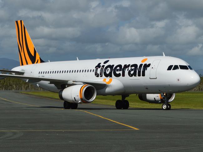 AIRLIE BEACH .. for Briar Jensen story .. Inaugural Tigerair service touches down at Whitsunday Coast Airport 1 April 2014