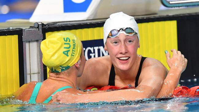 Taylor Ruck hugs Ariarne Titmus after touching her out by 0.04 of a second. Picture: AAP Image/Darren England