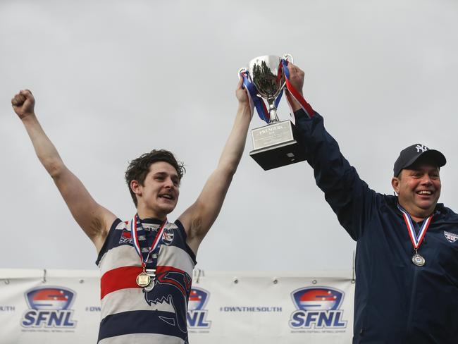 Highett captain Tom Brown and coach Sam Hecker celebrating their victory. Picture: Valeriu Campan