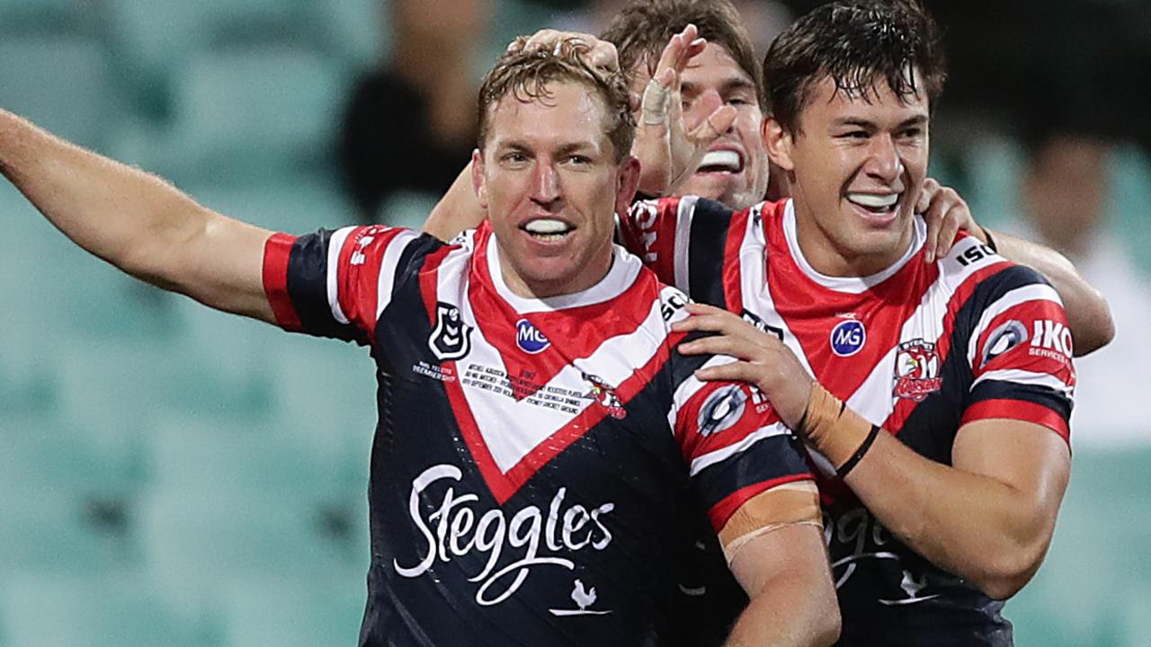 Mitchell Aubusson of the Roosters celebrates scoring a try.