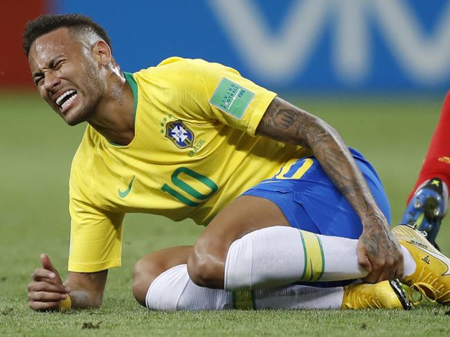 FILE - In this Friday, July 6, 2018 file photo Brazil's Neymar holds his shinbone during the quarterfinal match between Brazil and Belgium at the 2018 soccer World Cup in the Kazan Arena, in Kazan, Russia. (AP Photo/Francisco Seco, File)