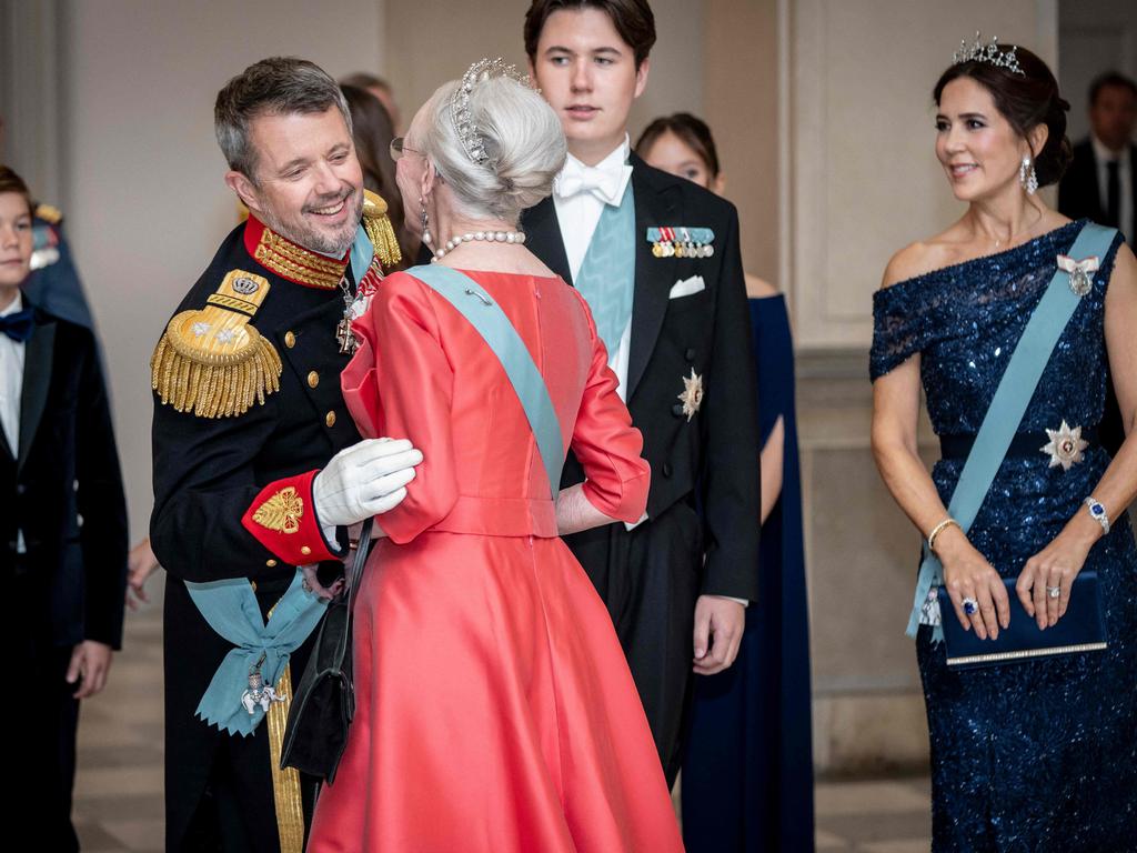 Queen Margrethe with Crown Prince Frederik, Prince Christian and Crown Princess Mary in October. She will step down on Sunday. Picture: AFP