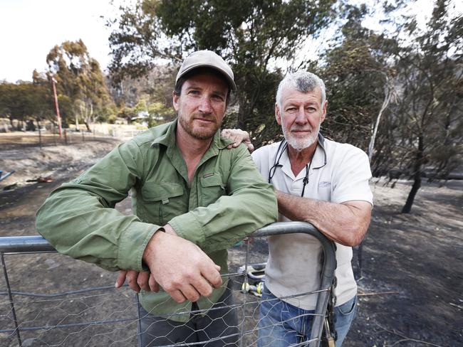 Simon Green with his father Barry Green out the front of his Pelham property which was saved by firefighters. Picture: ZAK SIMMONDS