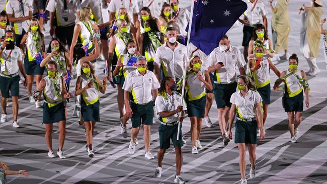 Flag bearers Cate Campbell and Patty Mills lead Australia. (Photo by Patrick Smith/Getty Images)