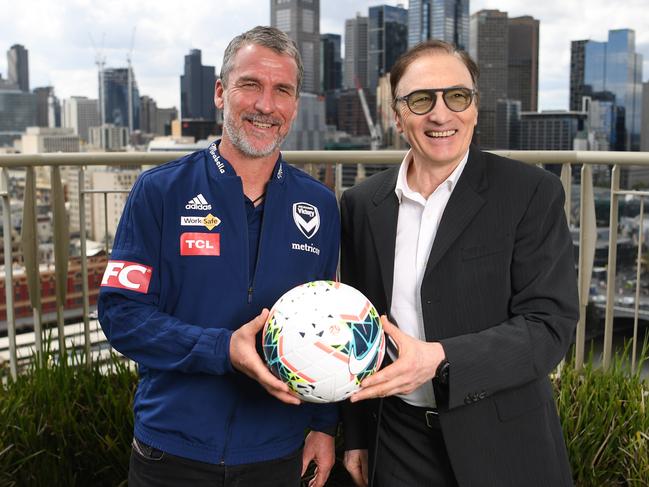 Melbourne Victory coach Marco Kurz (left) and Melbourne City coach Erick Mombaerts after seen after a press conference at the Langham Hotel in Melbourne, Friday, October 11, 2019. (AAP Image/Julian Smith) NO ARCHIVING