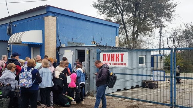 People waited at a security checkpoint on Sunday to cross the Kerch Strait by ferry.Picture: Getty Images