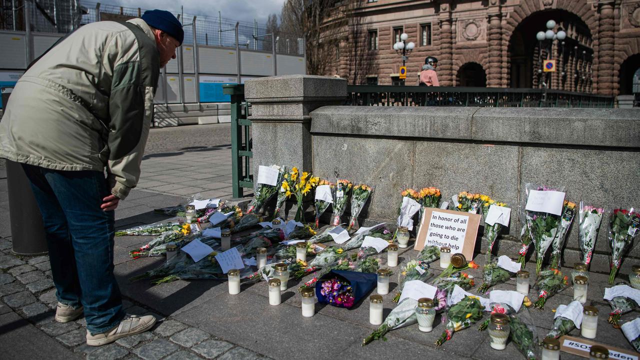 Picture taken on April 29, 2020 shows a memorial in Stockholm’s Mynttorget square in memory of loved ones lost to the new coronavirus featuring candles, flowers and handwritten notes. Picture: AFP