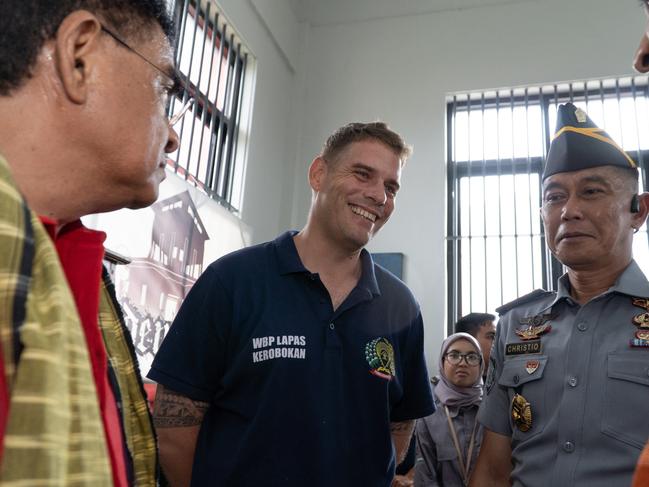 Matthew Norman was in good spirits as officials toured Kerobokan prison, where he is staying, on Friday. Picture: Lukman S. Bintoro